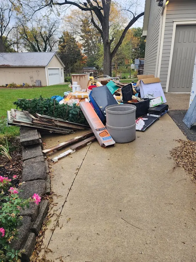 Dumpster being loaded with debris for Commercial Dumpster Rental in South Elgin